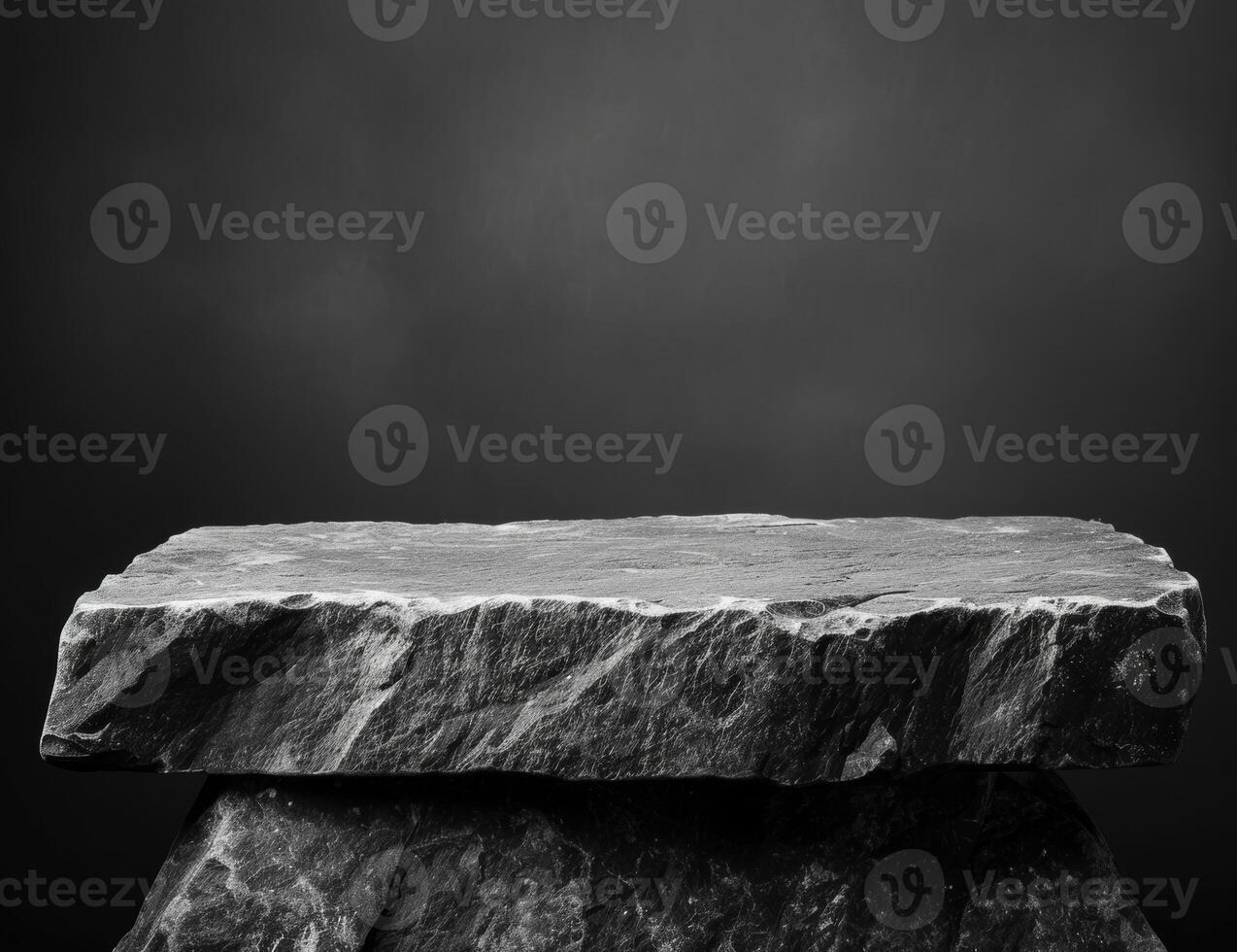 Dramatic stone slab on dark background photo