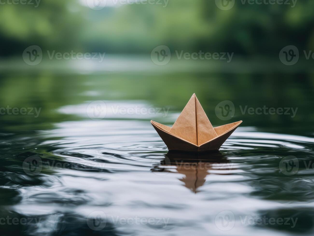 paper boat floating on a calm lake photo