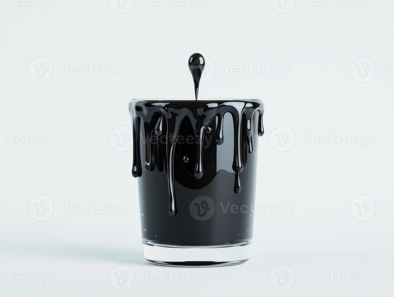 Dripping black paint in glass container photo