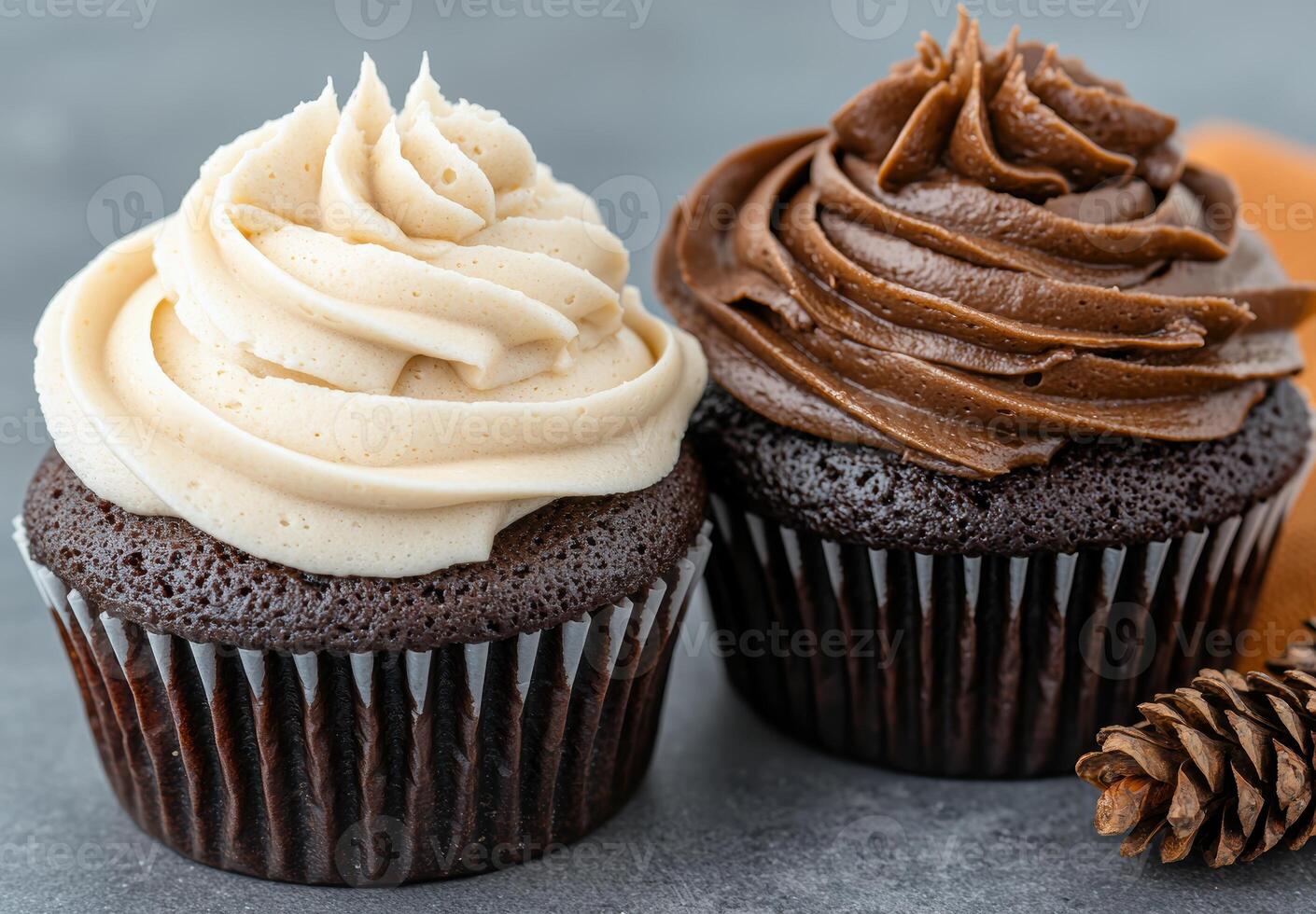 Delicious chocolate and vanilla cupcakes with swirled frosting photo