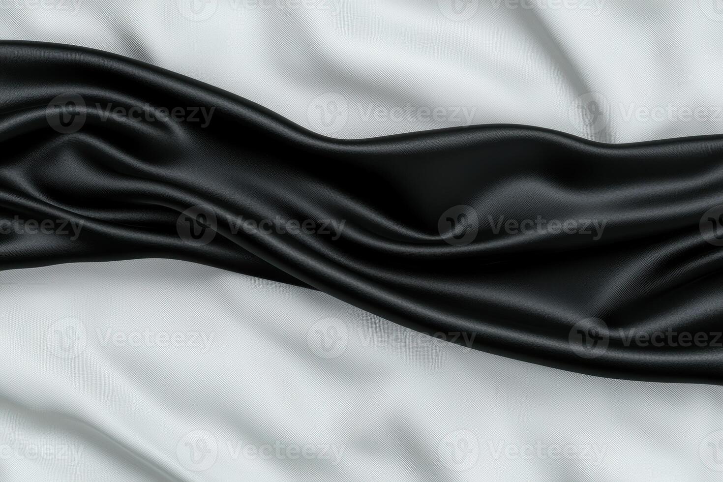 Flowing black fabric with blurred background photo