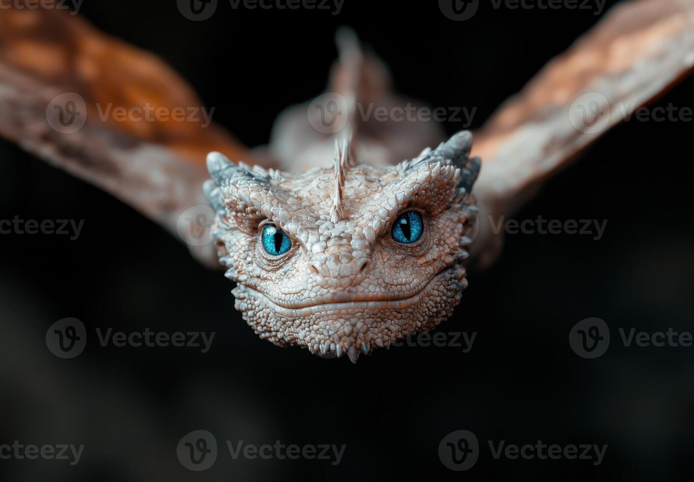 close up of a unique reptile with striking blue eyes photo