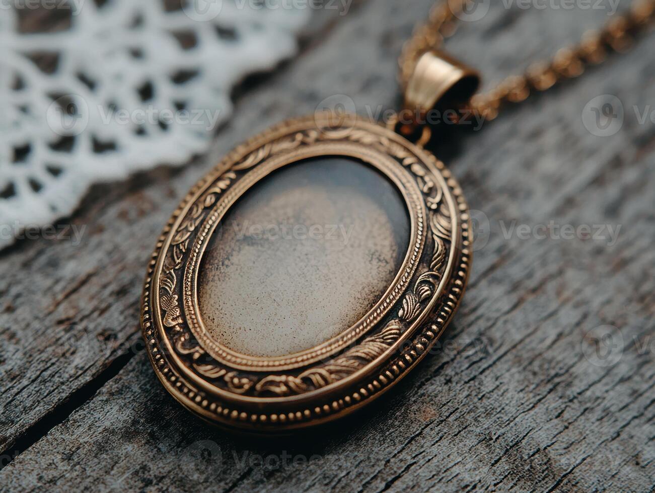 Antique golden locket on wooden surface photo