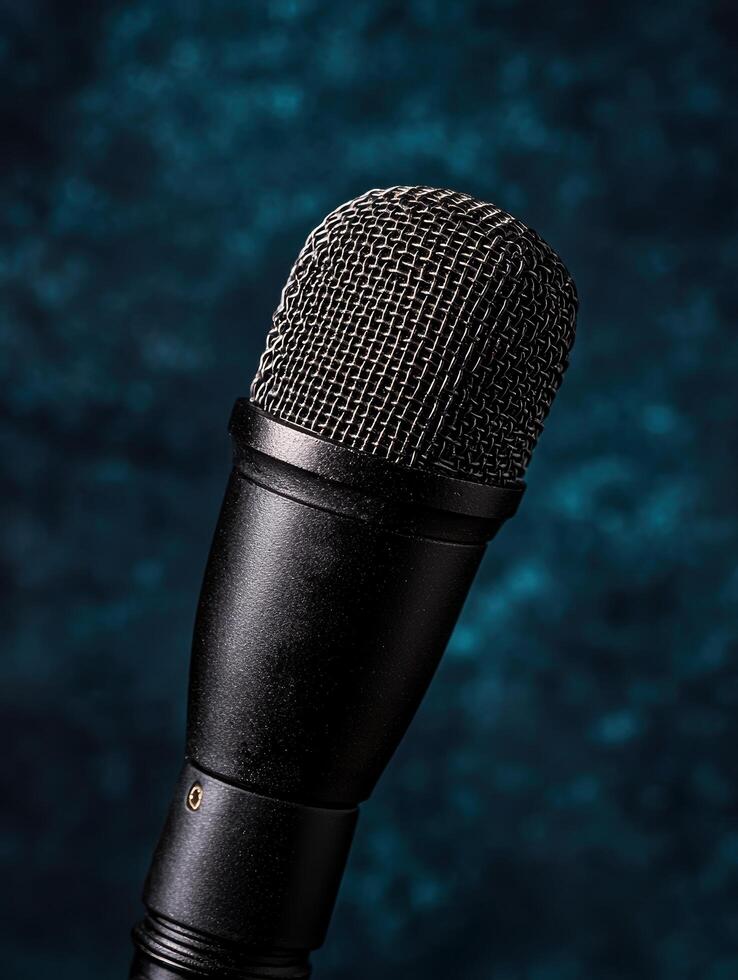 close up of a professional microphone against a dark background photo