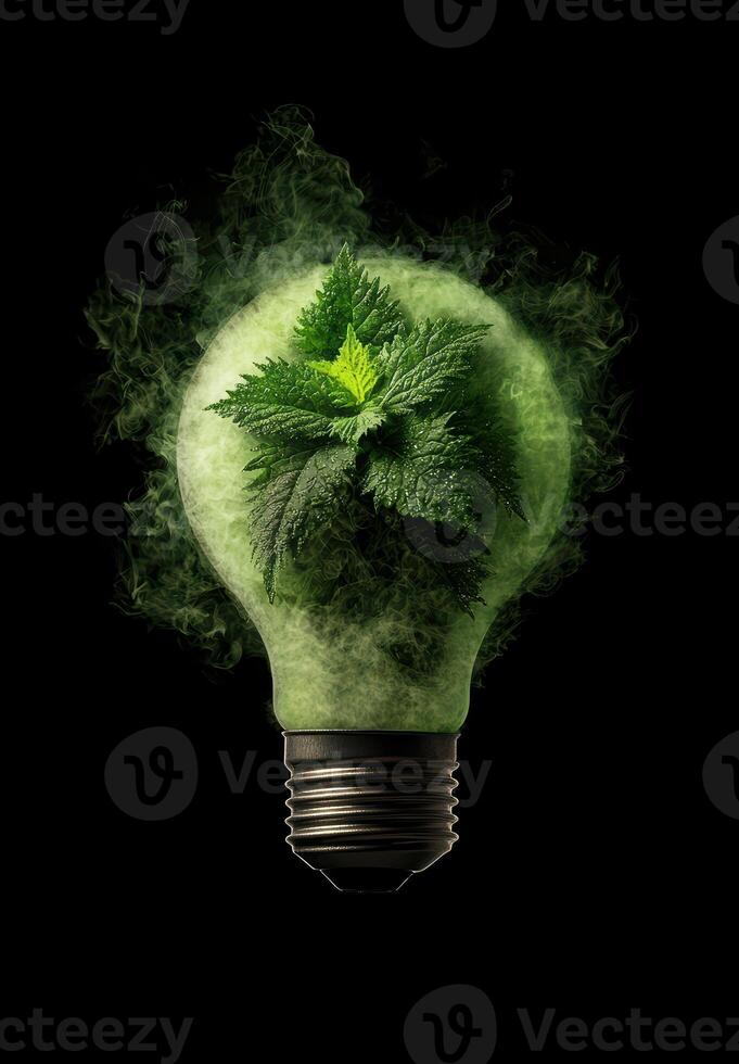 Glowing green plant in light bulb photo