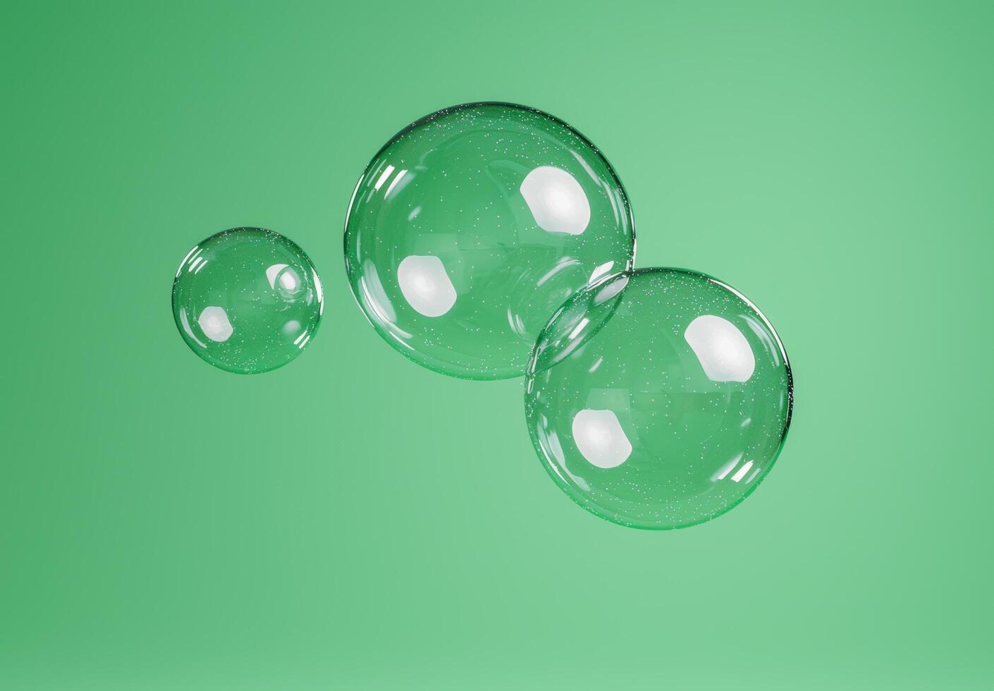 Transparent glass bubbles floating on green background photo