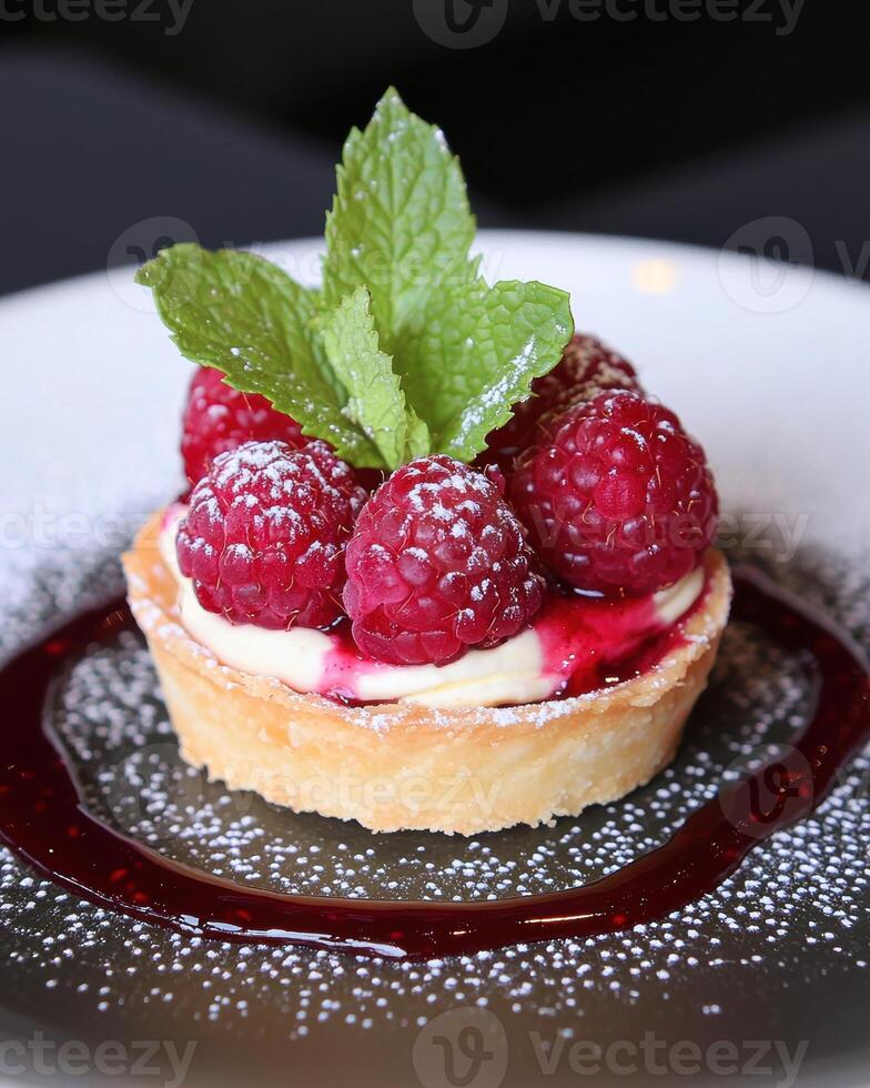 Delicious raspberry tart with mint garnish photo