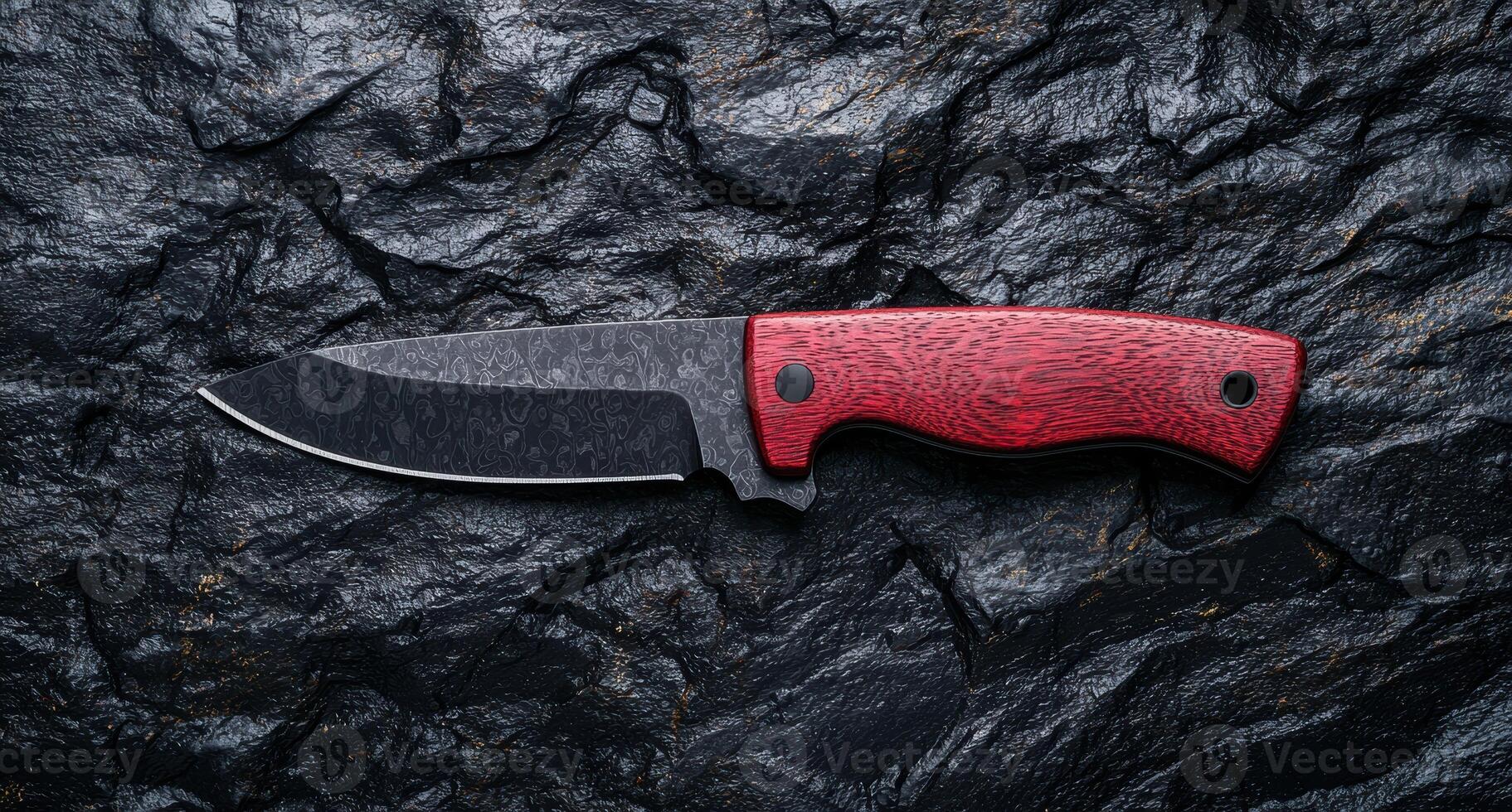 Closeup of a sharp hunting knife with a red wooden handle photo
