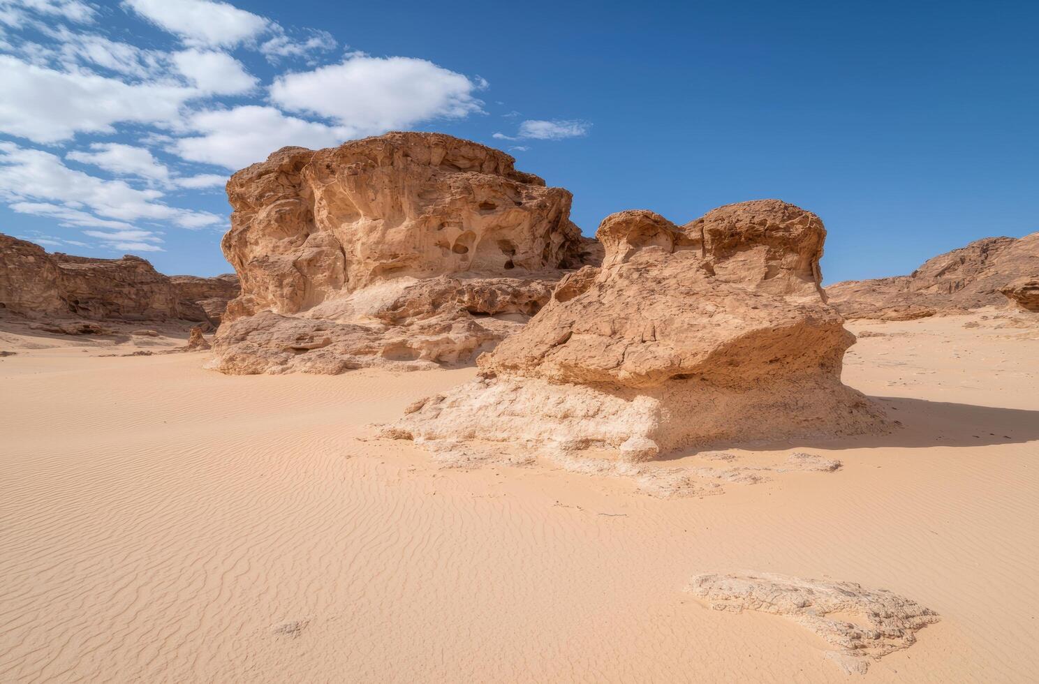 Dramatic desert landscape with rugged rock formations photo