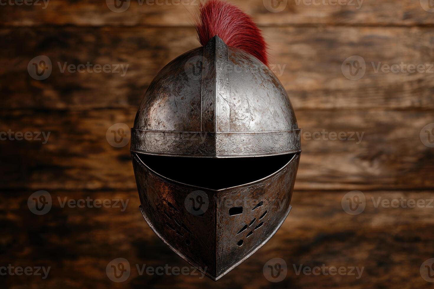 Ornate medieval knights helmet with red plume photo