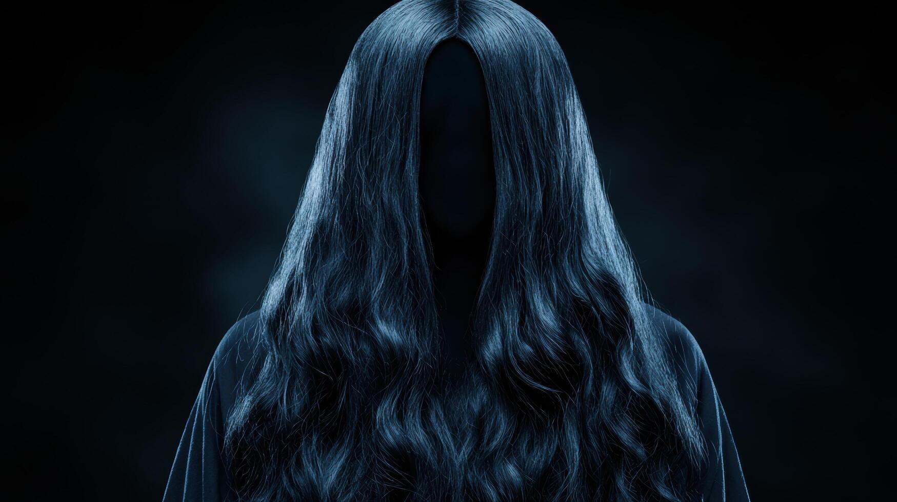 A woman with long hair and a black hood photo