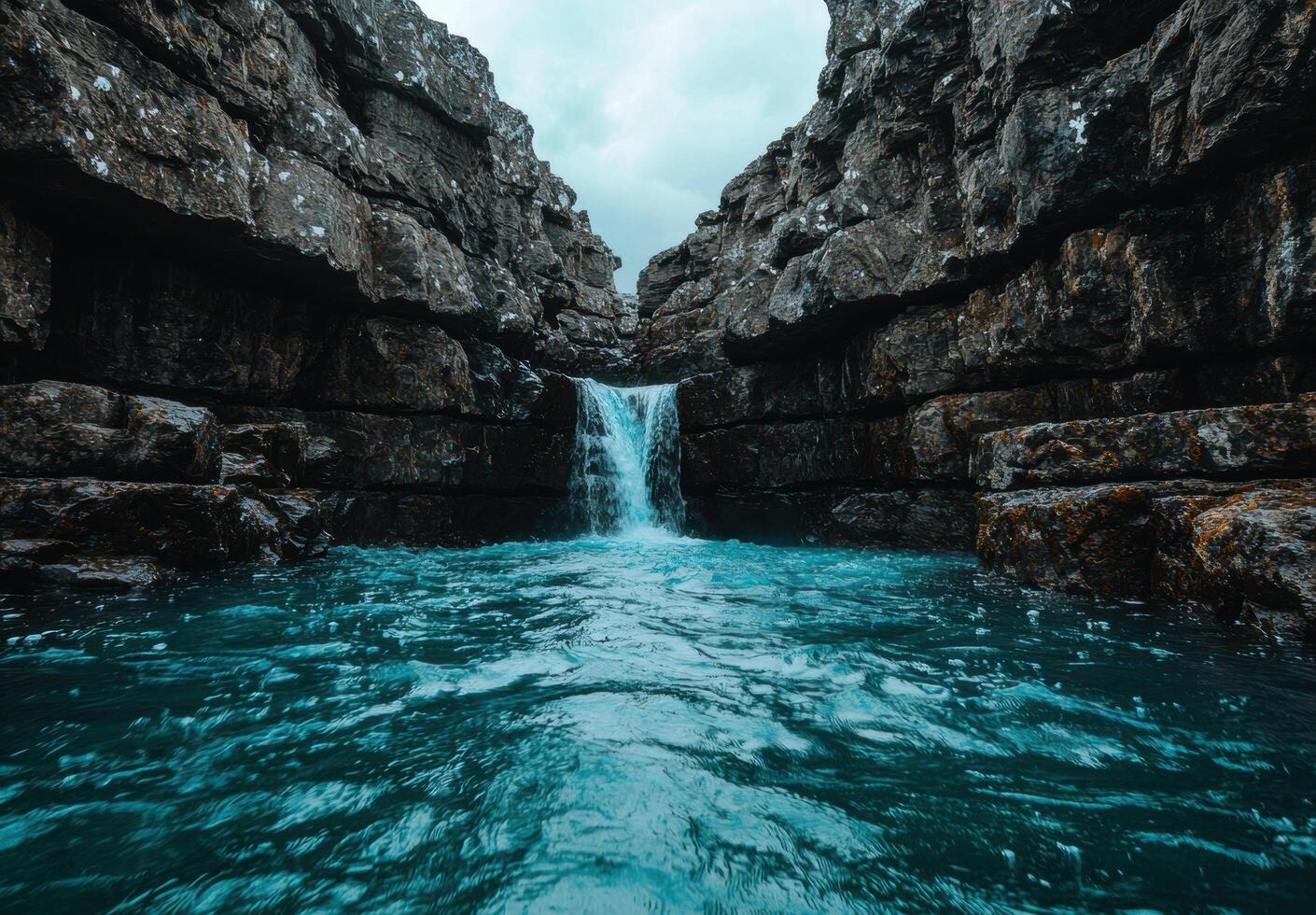 Stunning waterfall cascading into a turquoise pool photo
