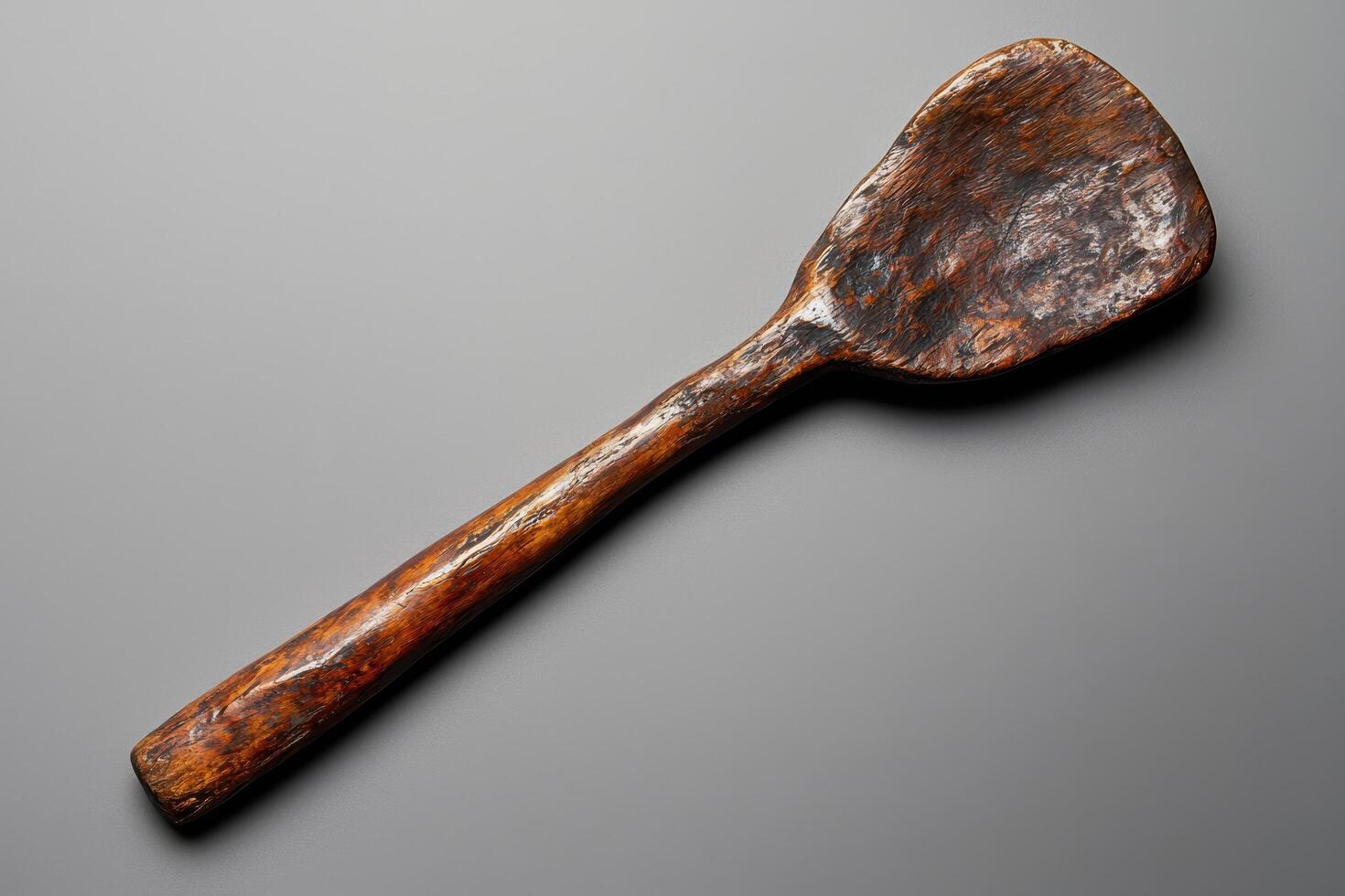 Antique wooden spoon with rustic texture photo