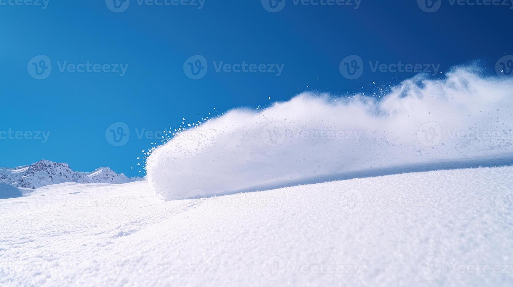 A snowboarder is riding down a snowy slope photo