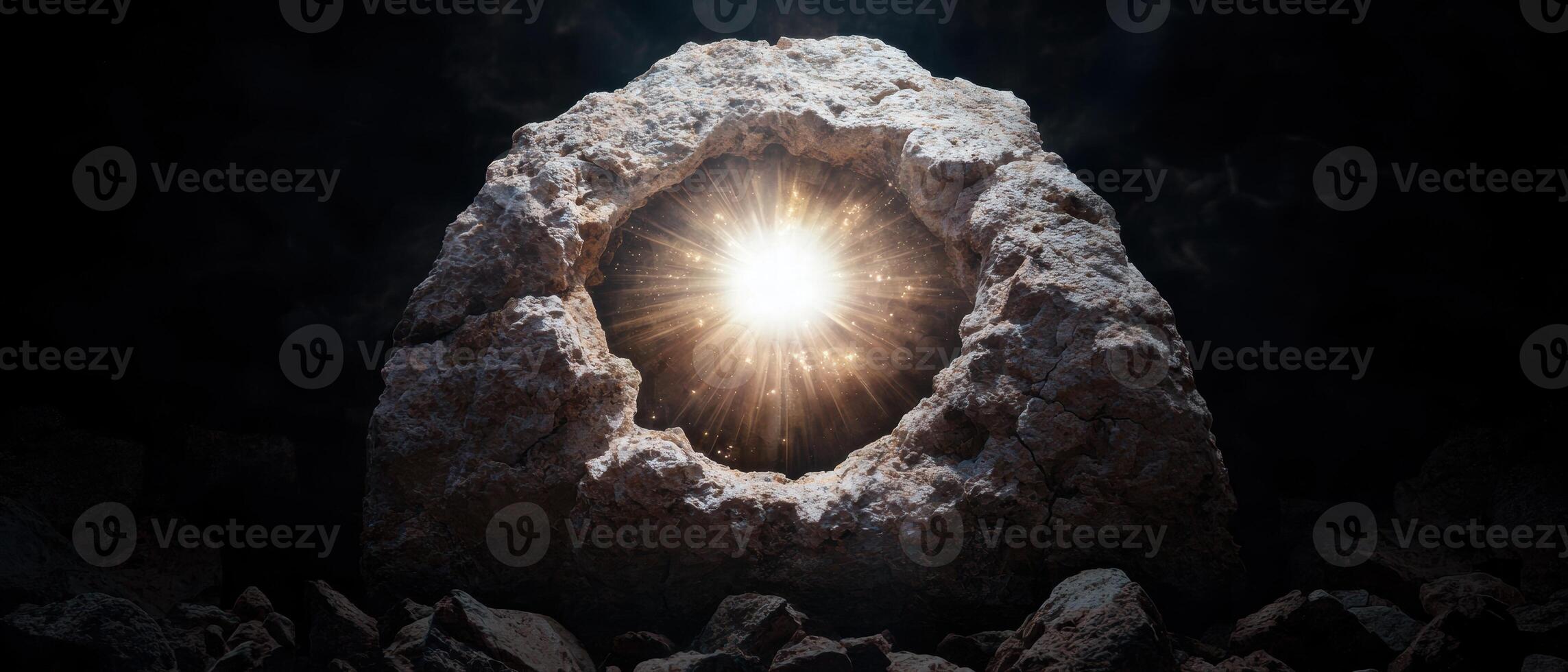An image of a rock with a sun shining through it photo