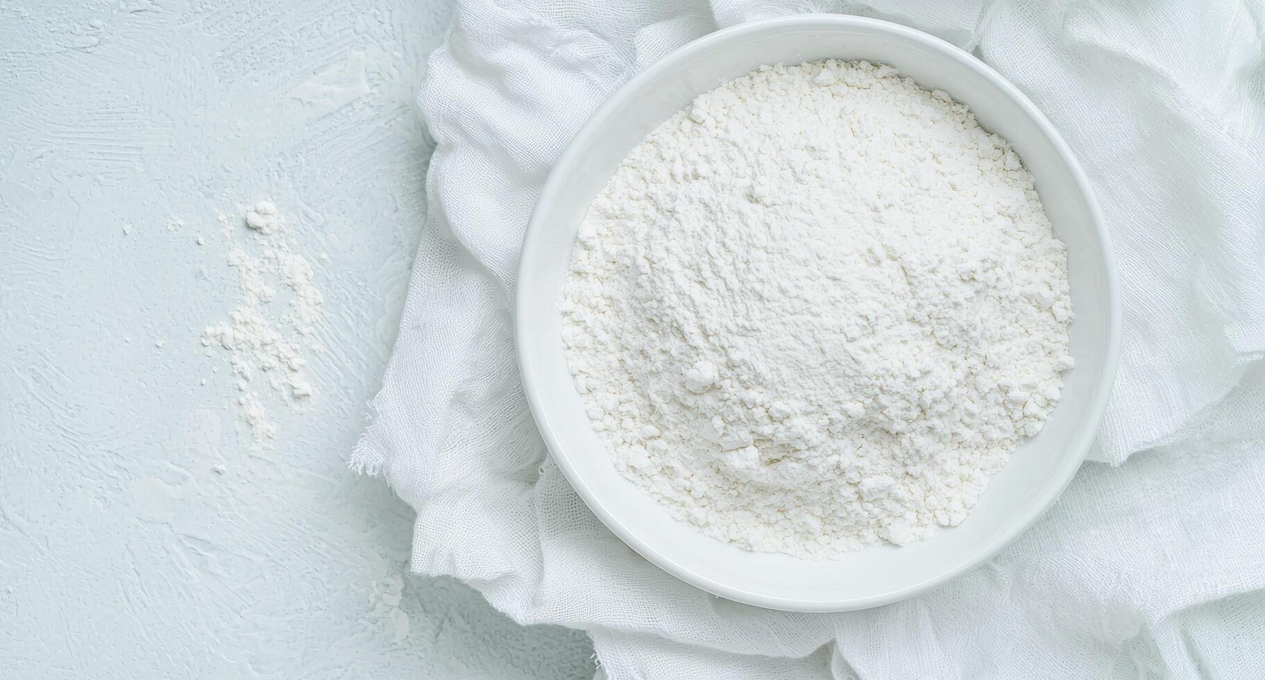 Freshly milled flour in a white bowl photo