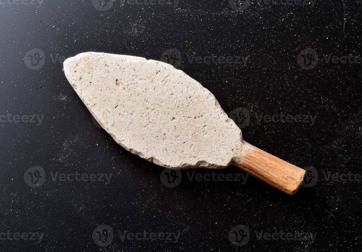 Antique stone mortar and pestle on black background photo
