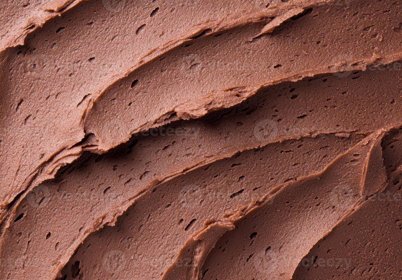 Close up of rich chocolate frosting texture photo