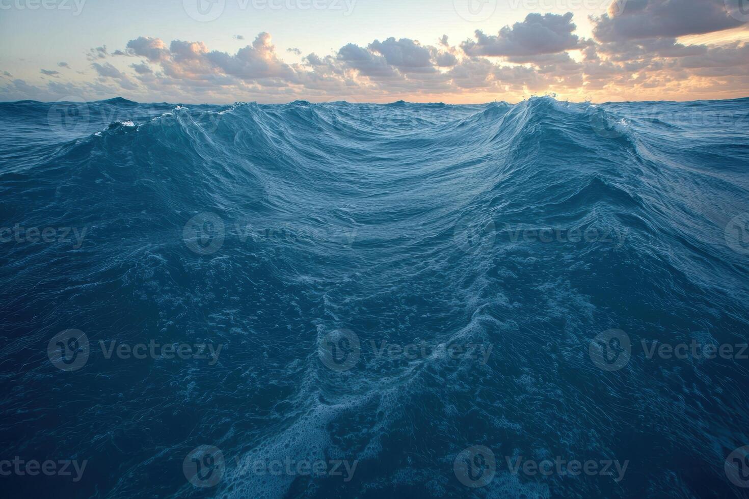 Dramatic ocean waves at sunset photo