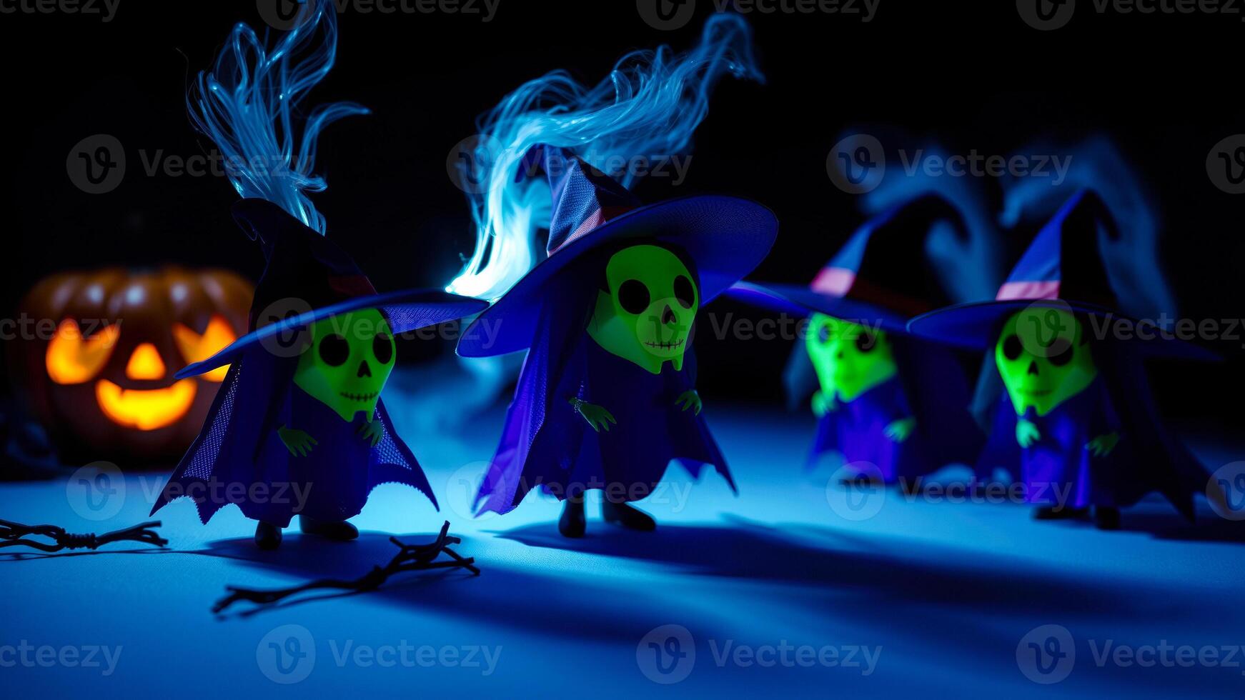 five skull-faced figures dressed blue cloaks hats stand on a blue surface photo