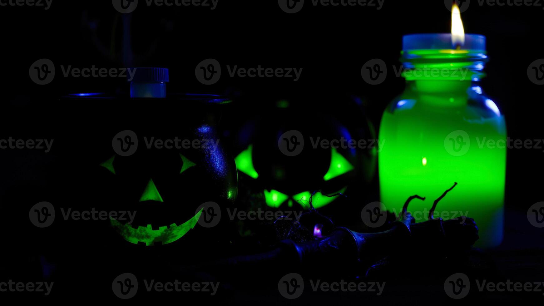 three glowing green objects on a dark surface photo