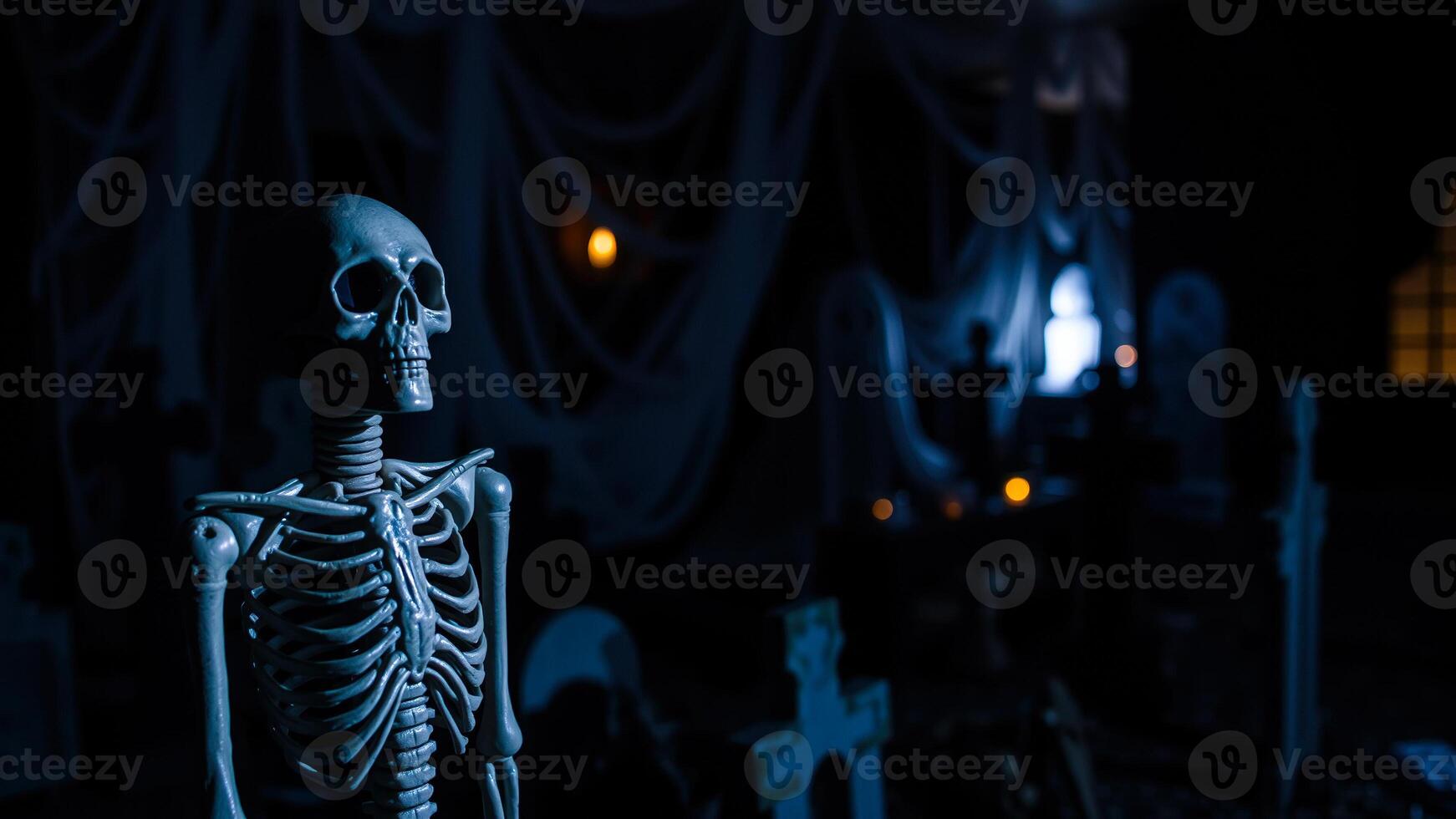 plastic skeleton stands against a spooky background photo