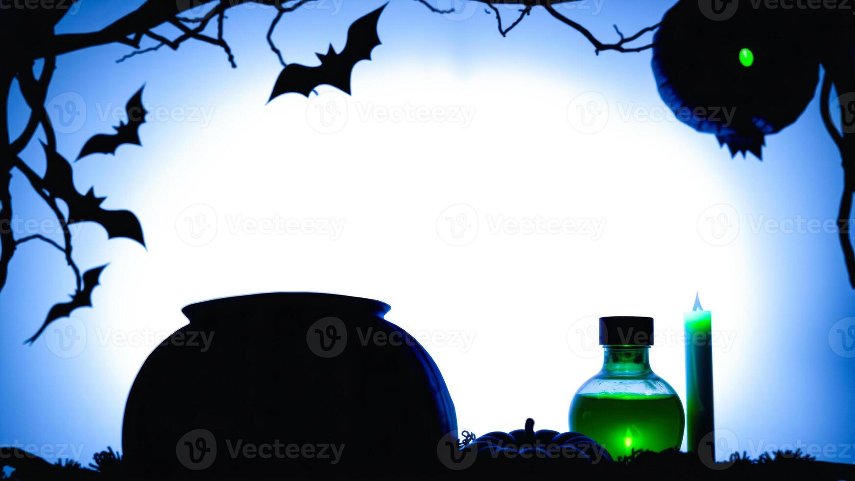 spooky halloween setup with a cauldron a potion bottle a candle photo