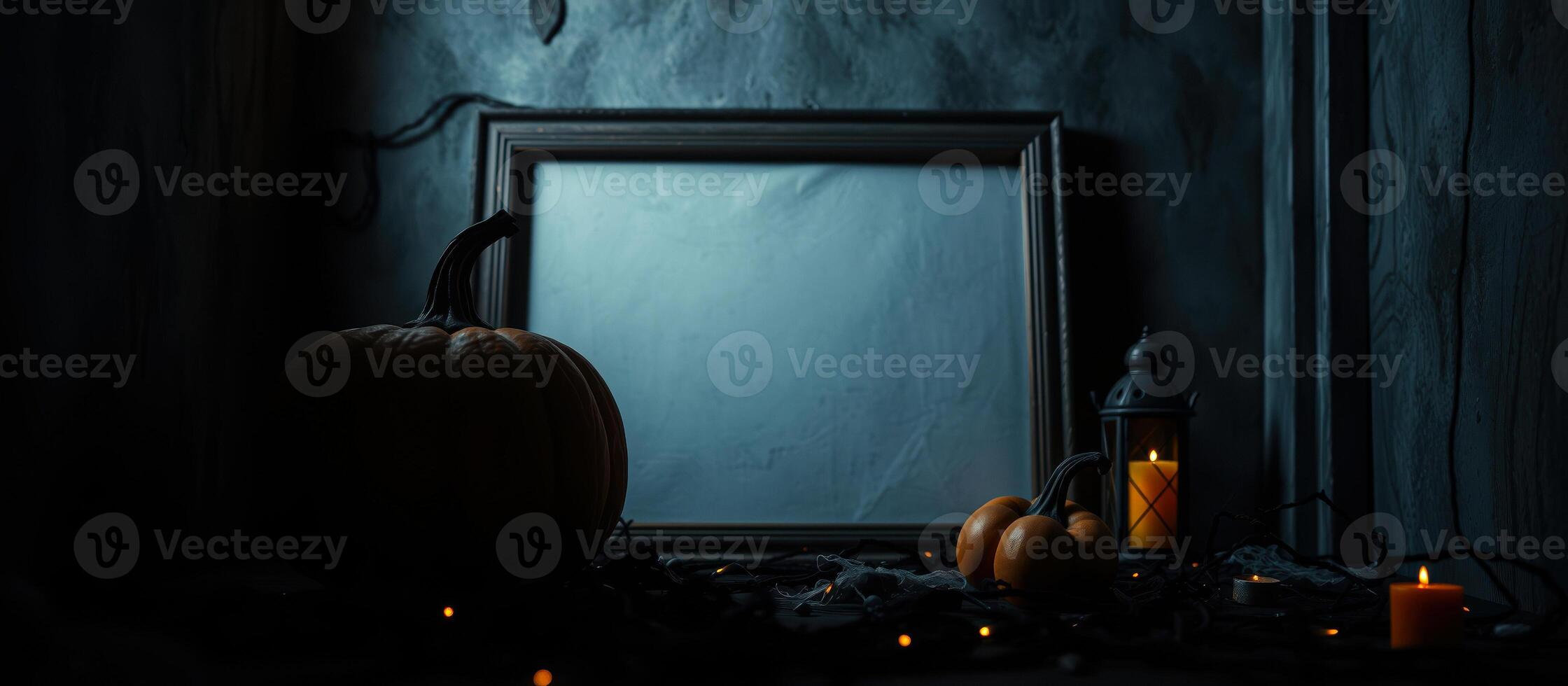 still life with a large pumpkin lit candles photo