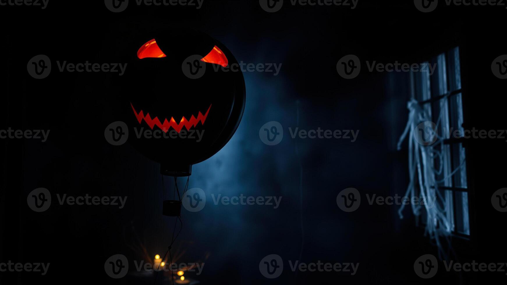 scary black balloon with an face floats the dark photo
