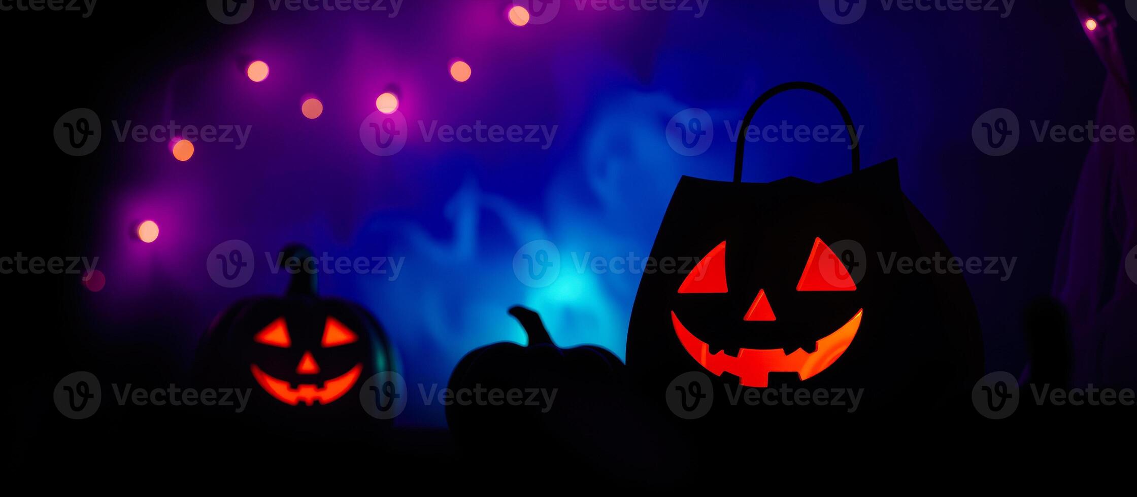 three illuminated jack-o'-lanterns create a spooky mood photo