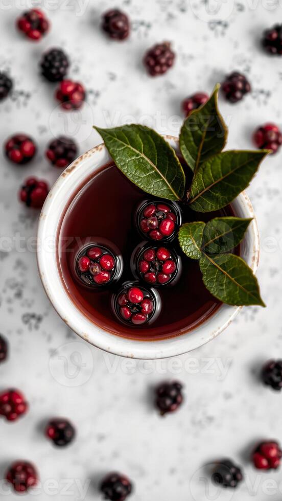 red berries a bowl with a green leaf photo