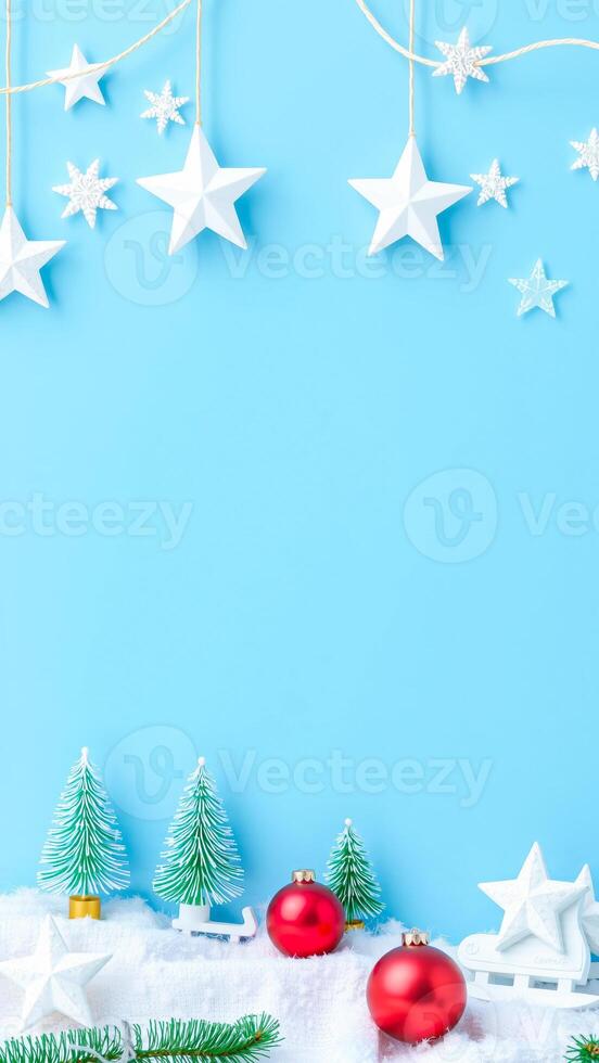 white paper stars snowflakes adorn a blue background with miniature holiday decorations photo
