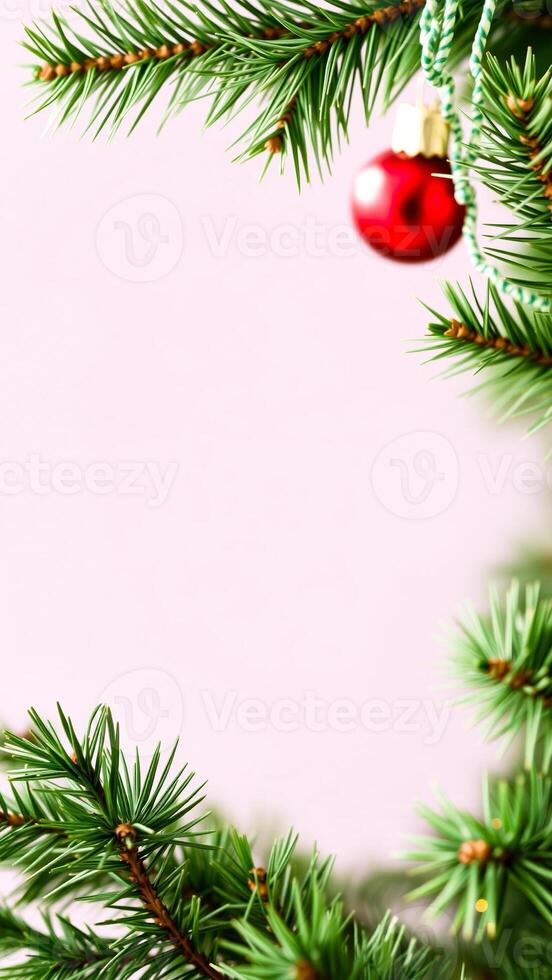 single red ornament on a green pine branch photo