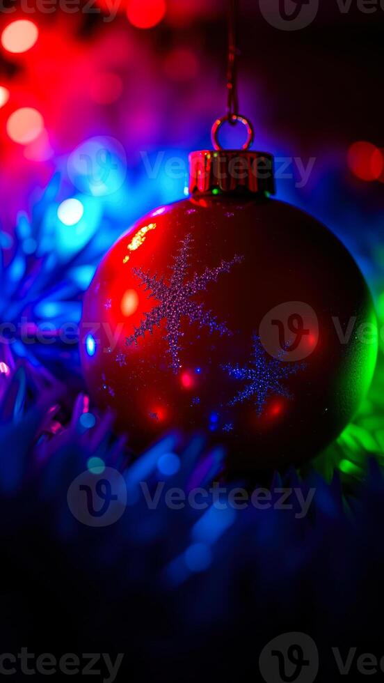 red ornament with a snowflake design on a festive backdrop photo