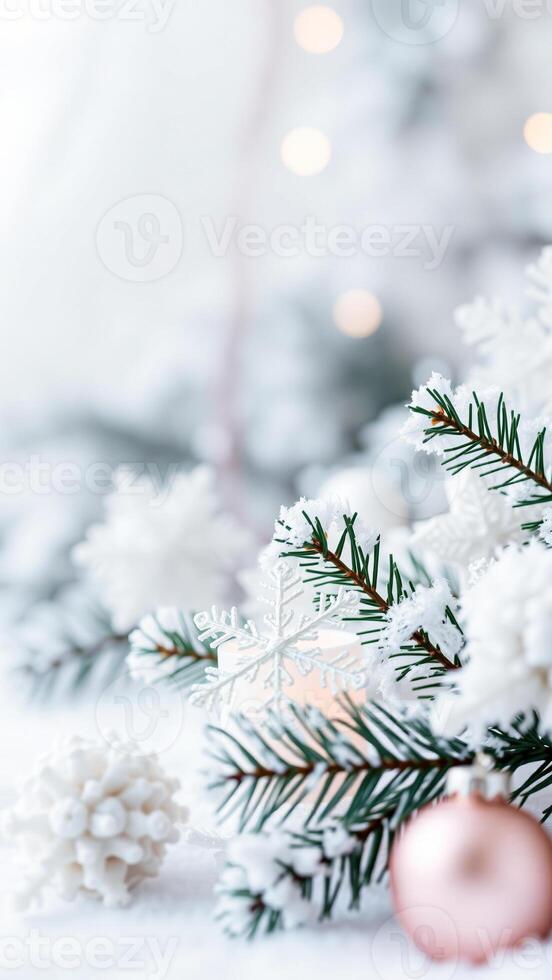 snowy evergreen branch with delicate snowflake ornament photo