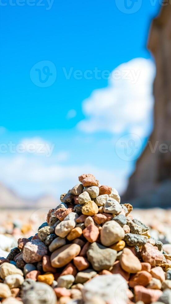 colorful stone pyramid against a blue sky photo