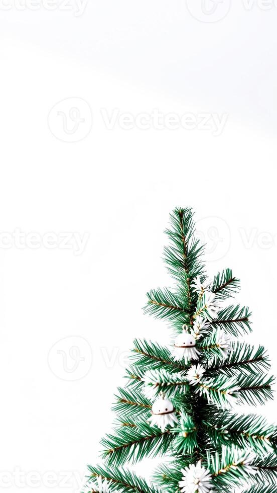 decorated pine branch with white bells photo