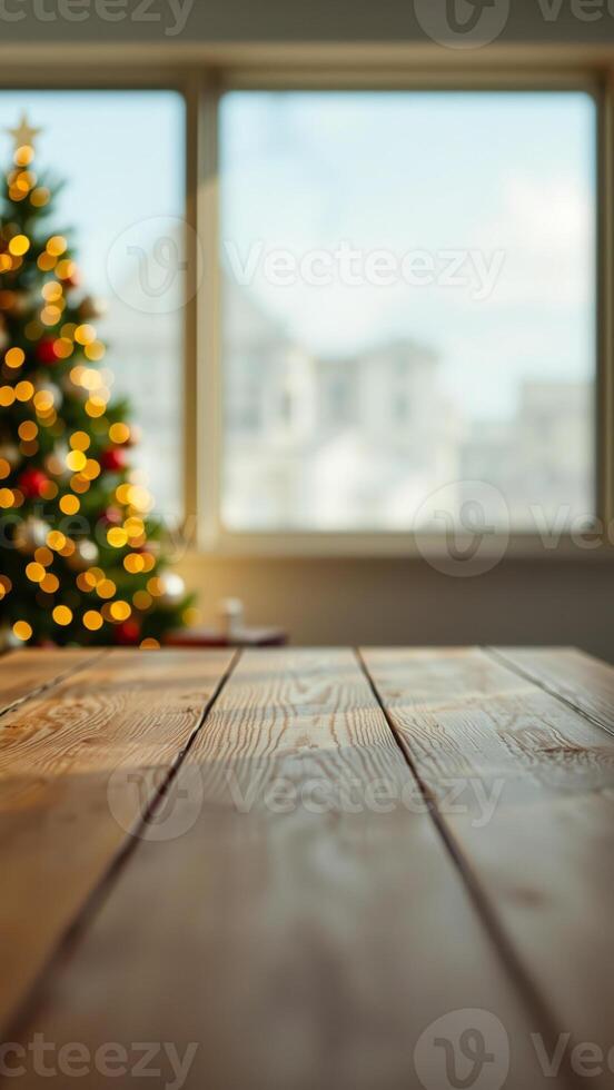 rustic wooden tabletop with a blurred christmas tree background photo