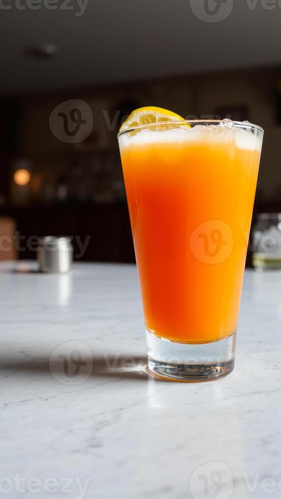 refreshing drink garnished with a lemon wedge photo