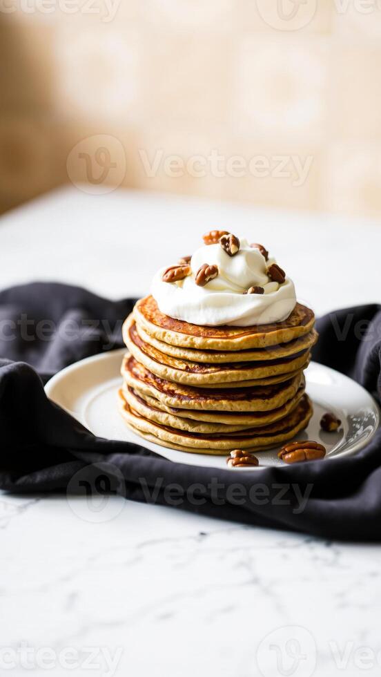 stack fluffy pancakes topped with cream pecans photo