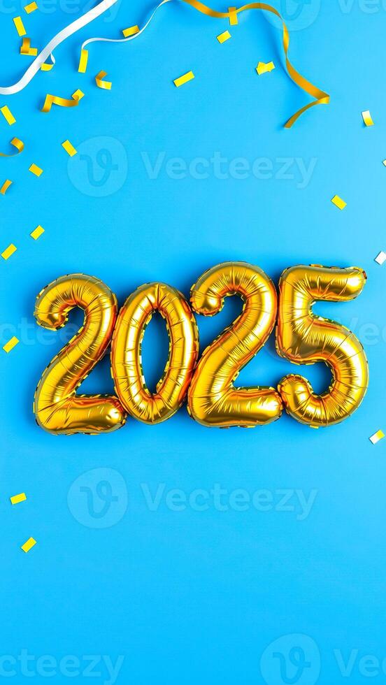 gold number balloons 2025 on blue background photo