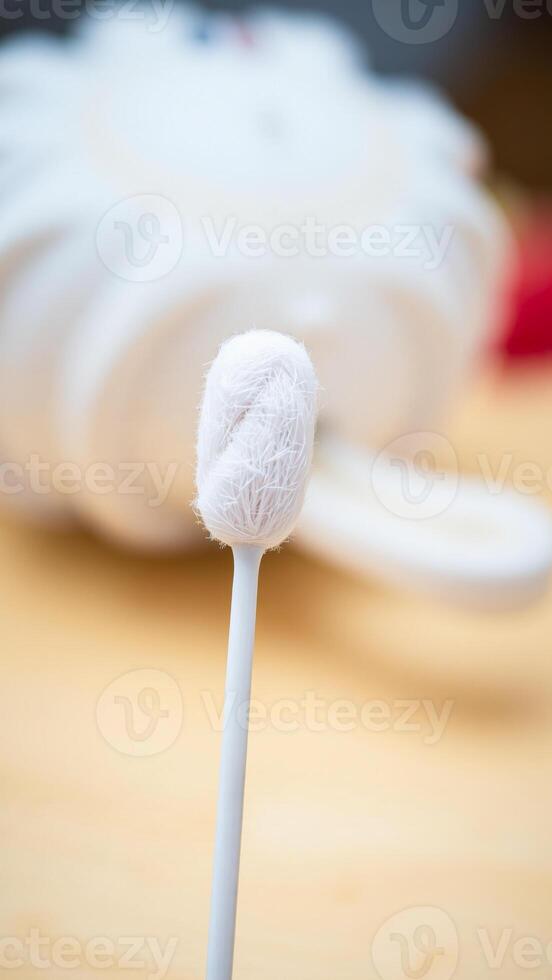 white cotton swab with a fluffy tip photo
