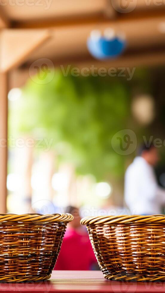 two wicker baskets on a red table photo
