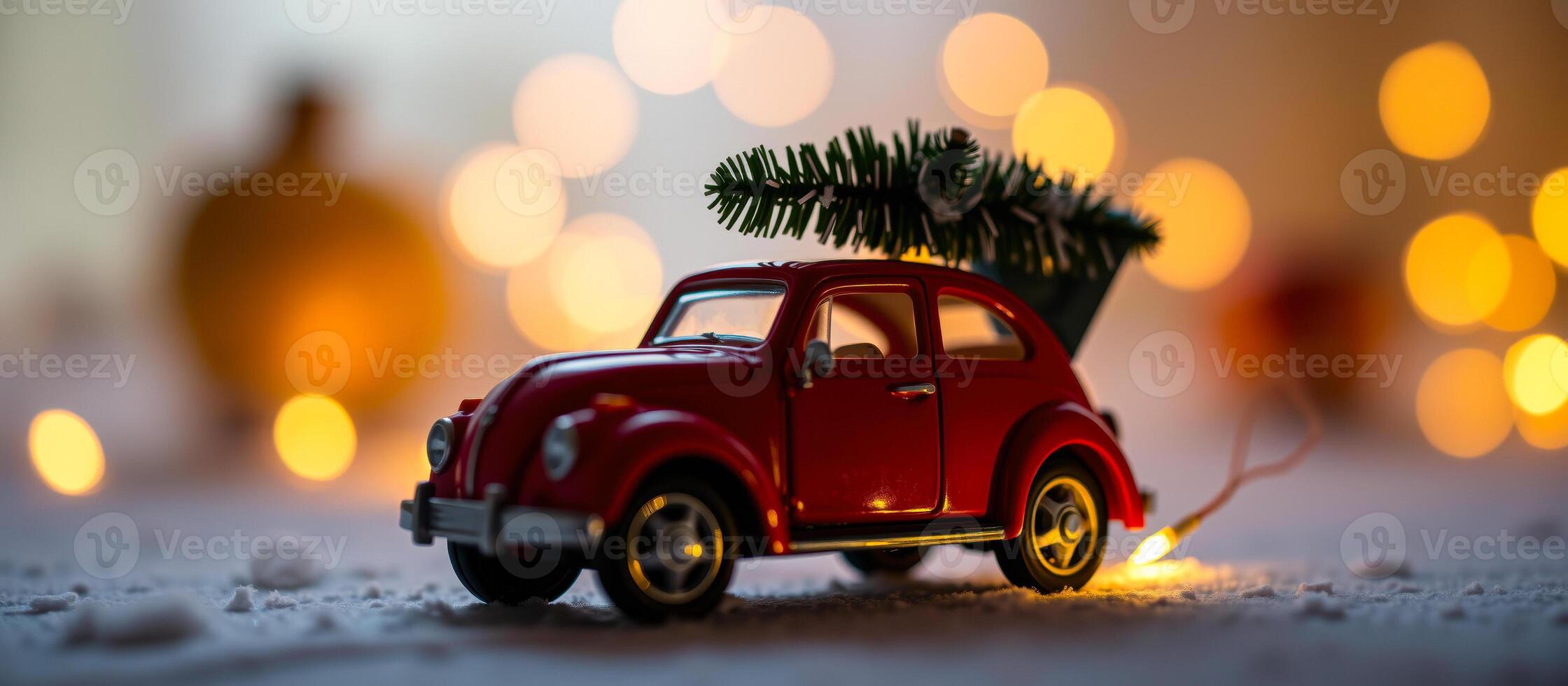 tiny red car hauling a christmas tree photo
