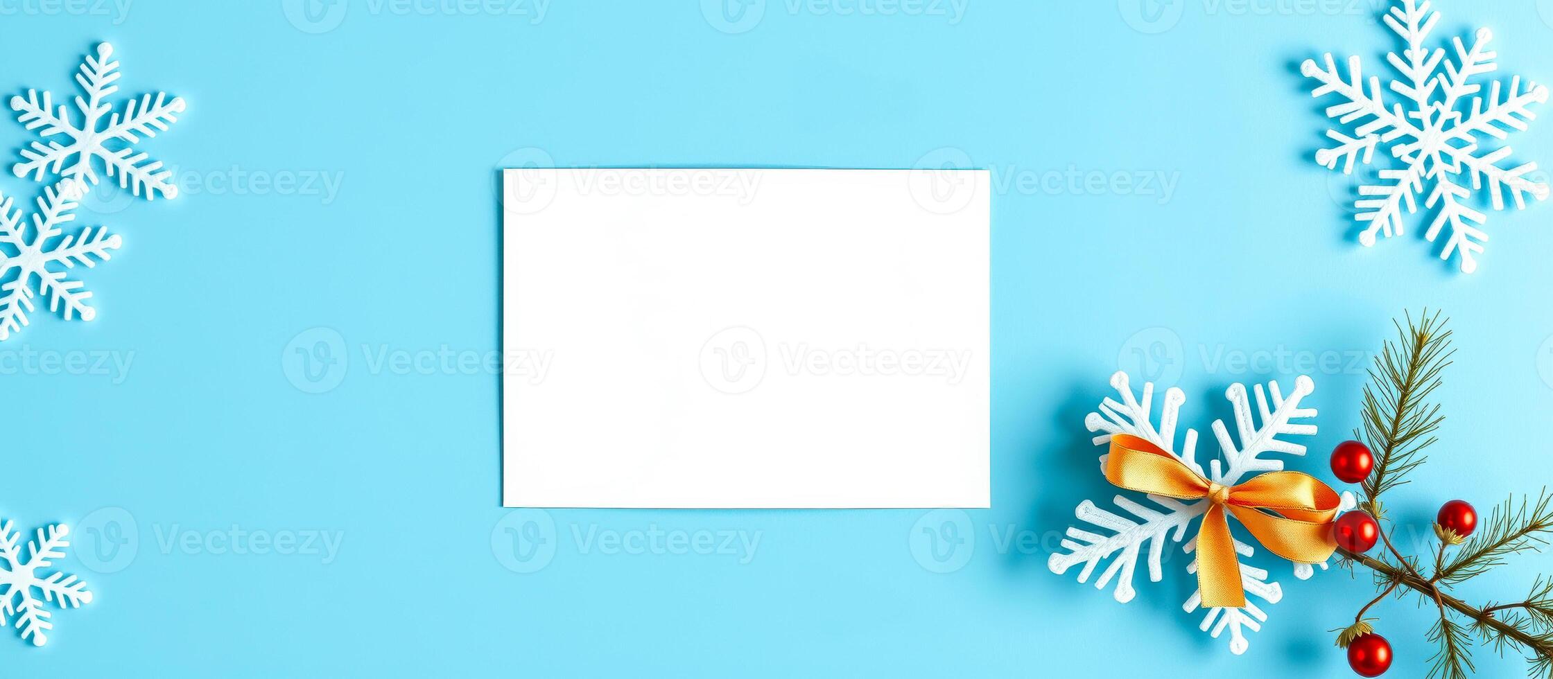 blank white card with white snowflakes on blue background photo