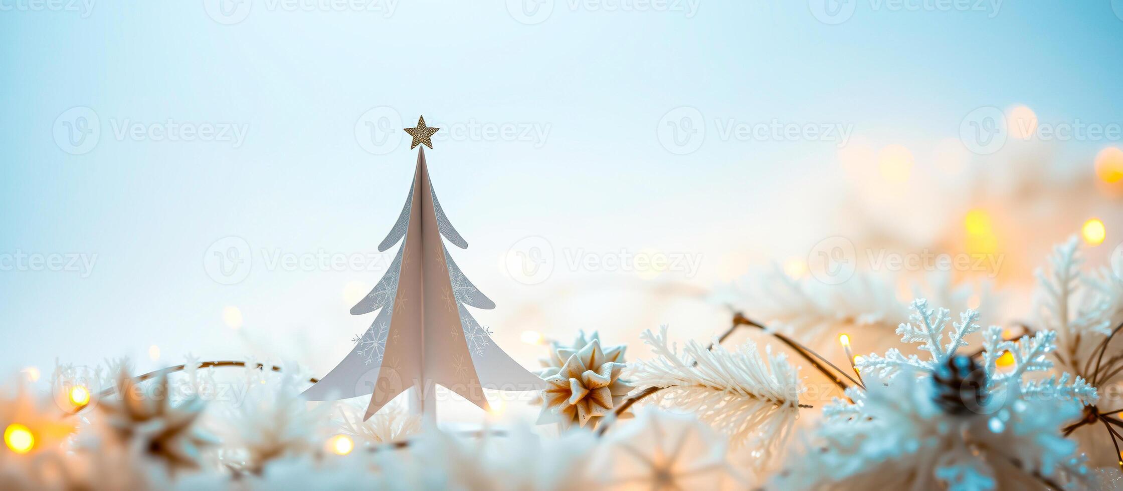 white paper christmas tree ornament with a gold star photo