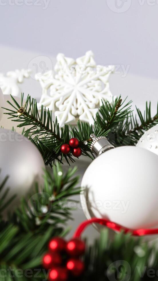 white holiday ornaments with a snowflake pine sprigs photo