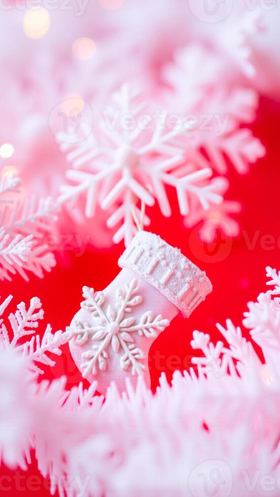 white stocking with snowflake design against a red background photo