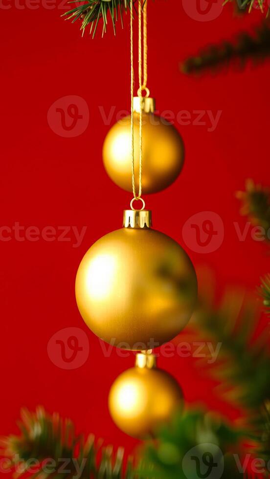 three golden ornaments on a red background photo
