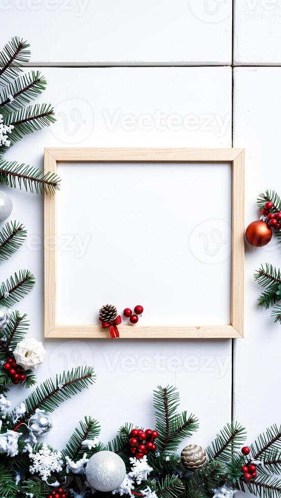 frame adorned with evergreen branches red berries photo